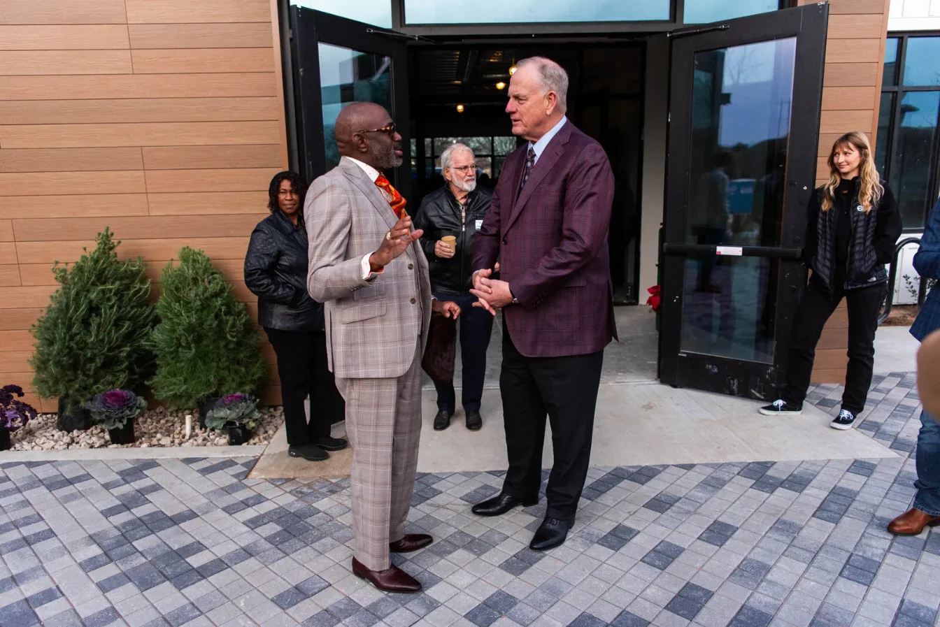 Guests talking at a building opening