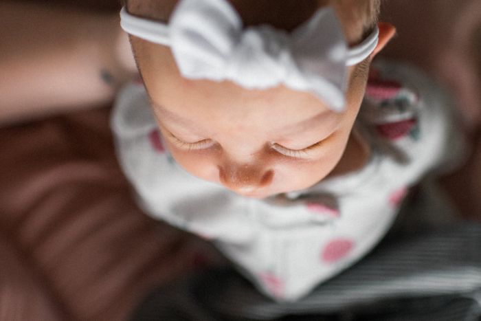 Newborn in a polka dot bow